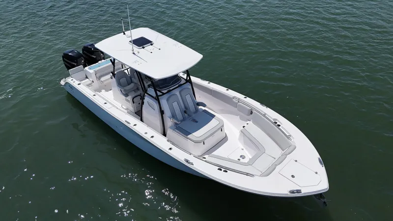 The Image of 2022 Sea Fox 328 Commander cruising on open water, clear blue sky. - 0