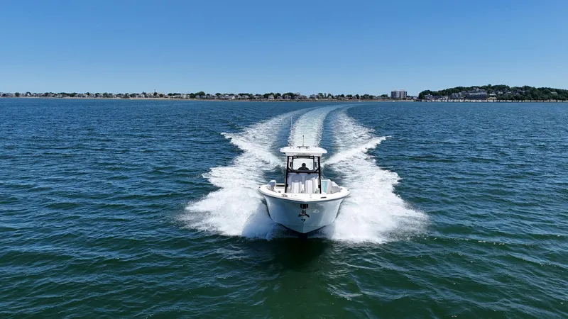 Slide: The Image of 2022 Sea Fox 328 Commander cruising on open water under clear blue skies. - 11