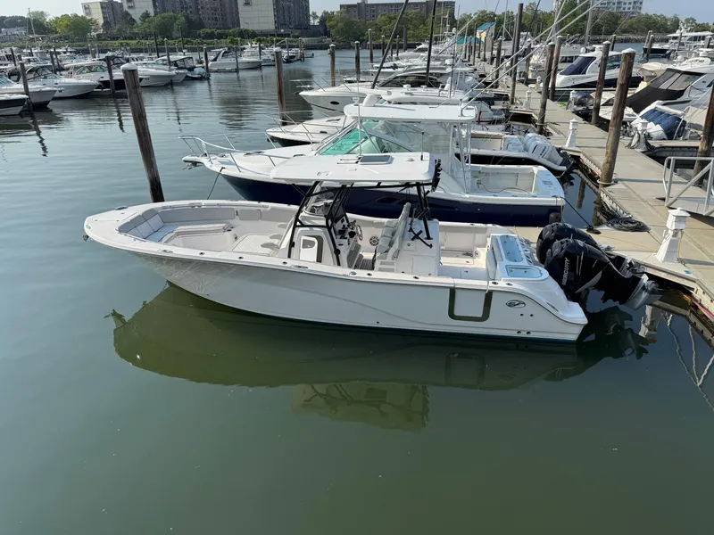 Slide: The Image of 2022 Sea Fox 328 Commander boat docked in a marina. - 19