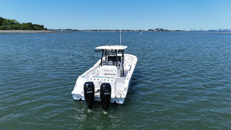 Slide: The Image of 2022 Sea Fox 328 Commander boat on open water with twin engines. - 7