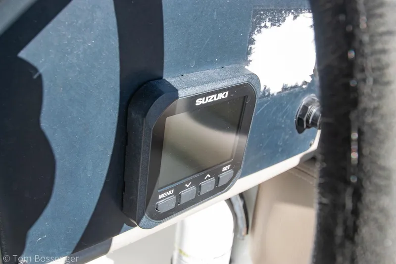 Slide: The Image of Suzuki display on 2021 Crownline 255 XSS boat dashboard. - 16