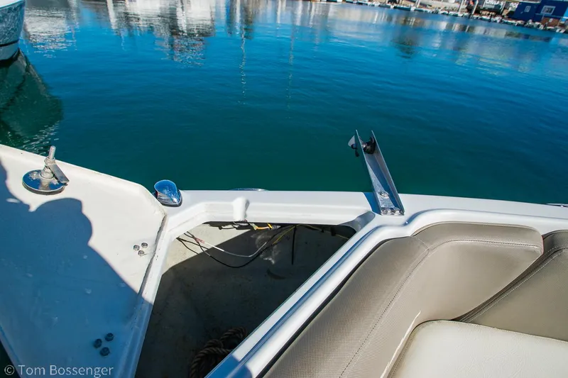 Slide: The Image of 2021 Crownline 255 XSS boat interior with water view in marina. - 25