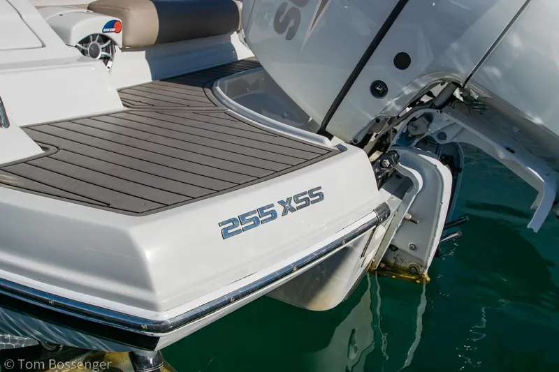 Slide: The Image of Crownline 255 XSS 2021 boat stern with outboard motor on water. - 4