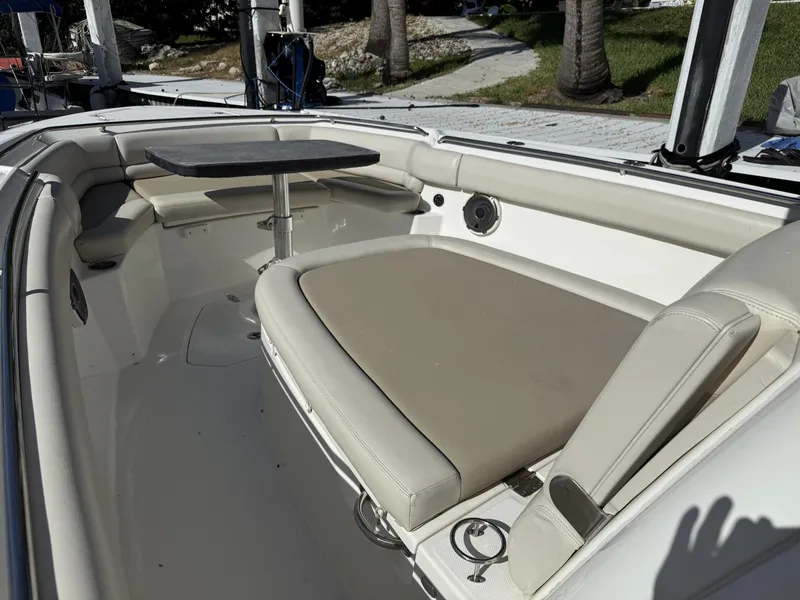 Slide: The Image of 2020 Boston Whaler 330 Outrage boat interior with seating and table. - 14
