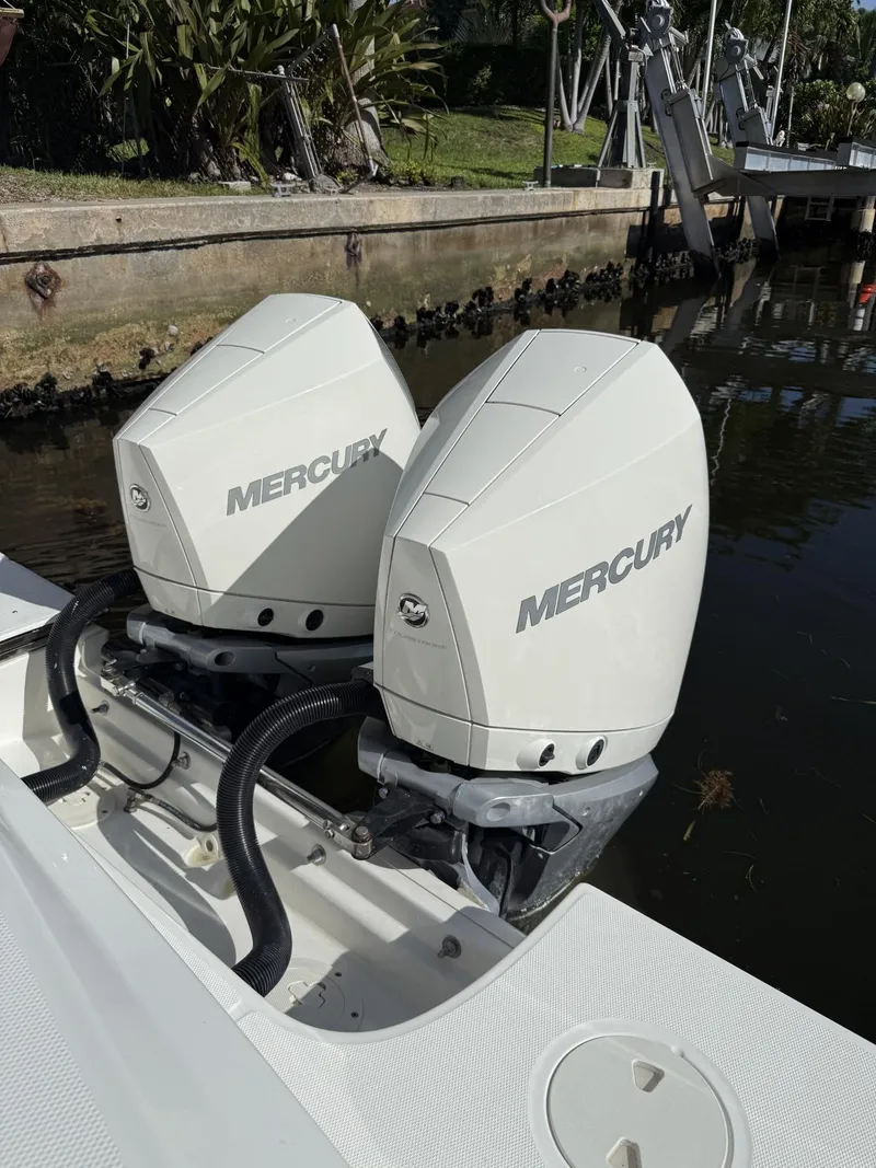 Slide: The Image of Twin Mercury outboard engines on a 2020 Boston Whaler 330 Outrage boat. - 37