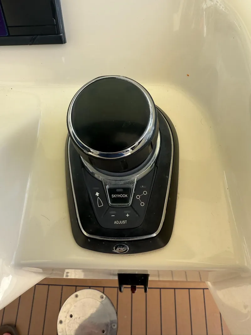 Slide: The Image of Control panel of 2019 Scout 420 LXF boat with switches and warning label. - 25