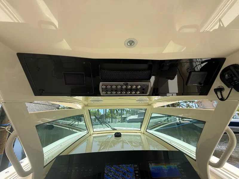 Slide: The Image of 2019 Scout 420 LXF boat with Garmin marine electronics and communication equipment. - 27