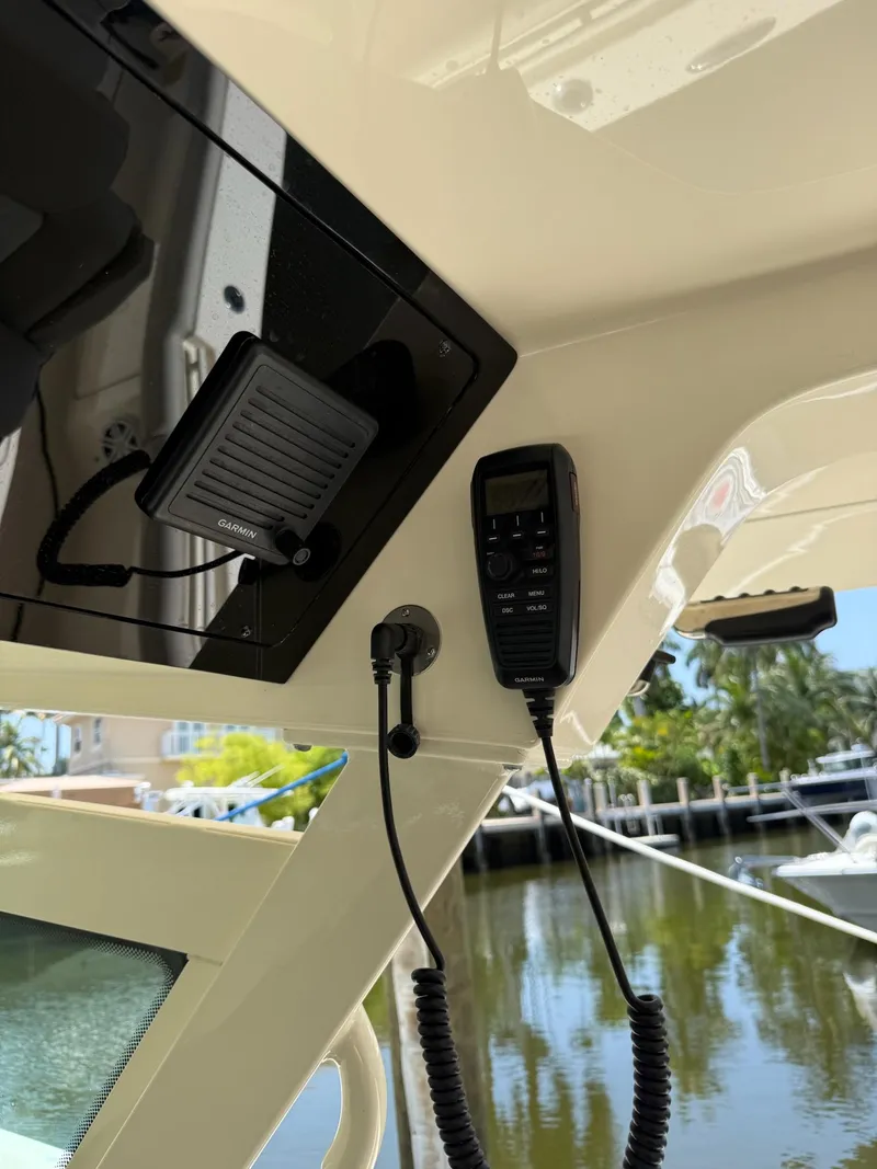 Slide: The Image of Dashboard of a 2019 Scout 420 LXF boat showing digital gauges and controls. - 28