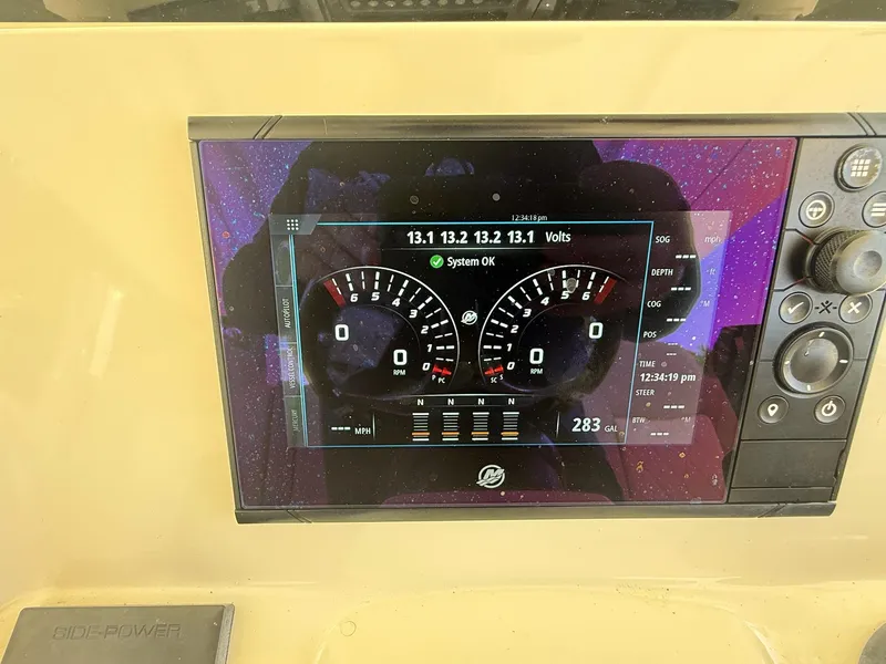 Slide: The Image of Control panel of a 2019 Scout 420 LXF boat with joystick and display. - 29