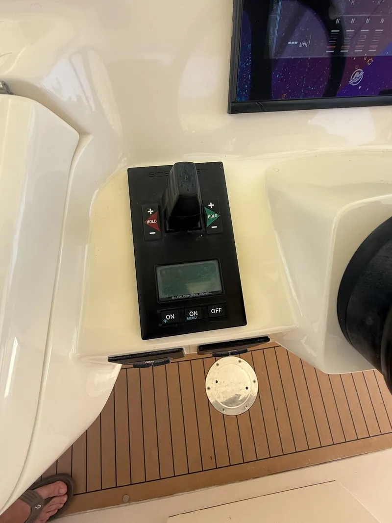 Slide: The Image of Control panel of a 2019 Scout 420 LXF boat with Lumishore switch. - 30