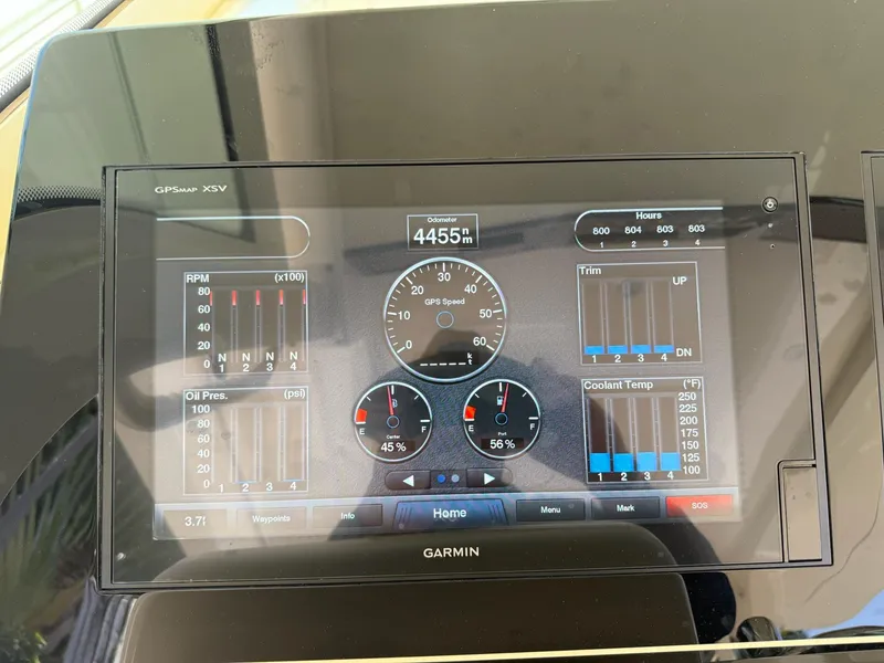 Slide: The Image of Dashboard of a 2019 Scout 420 LXF boat with fuel and water gauges. - 37