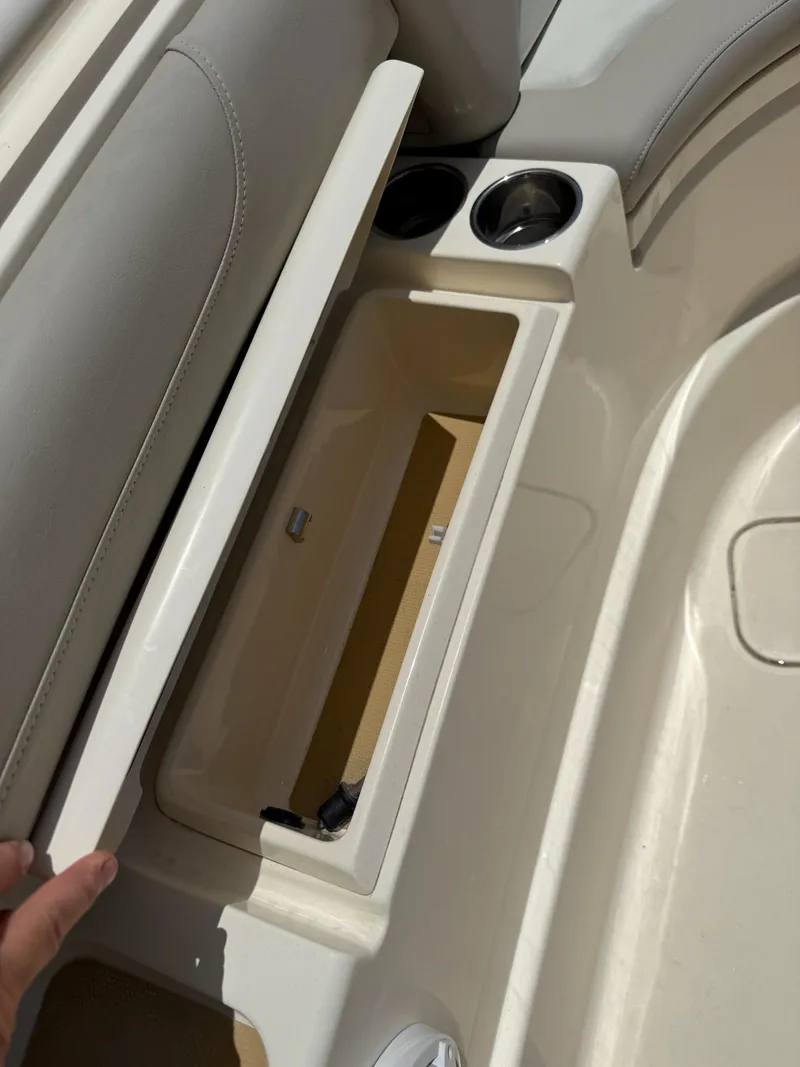 Slide: The Image of 2019 Scout 420 LXF boat interior with speaker and cup holders. - 42