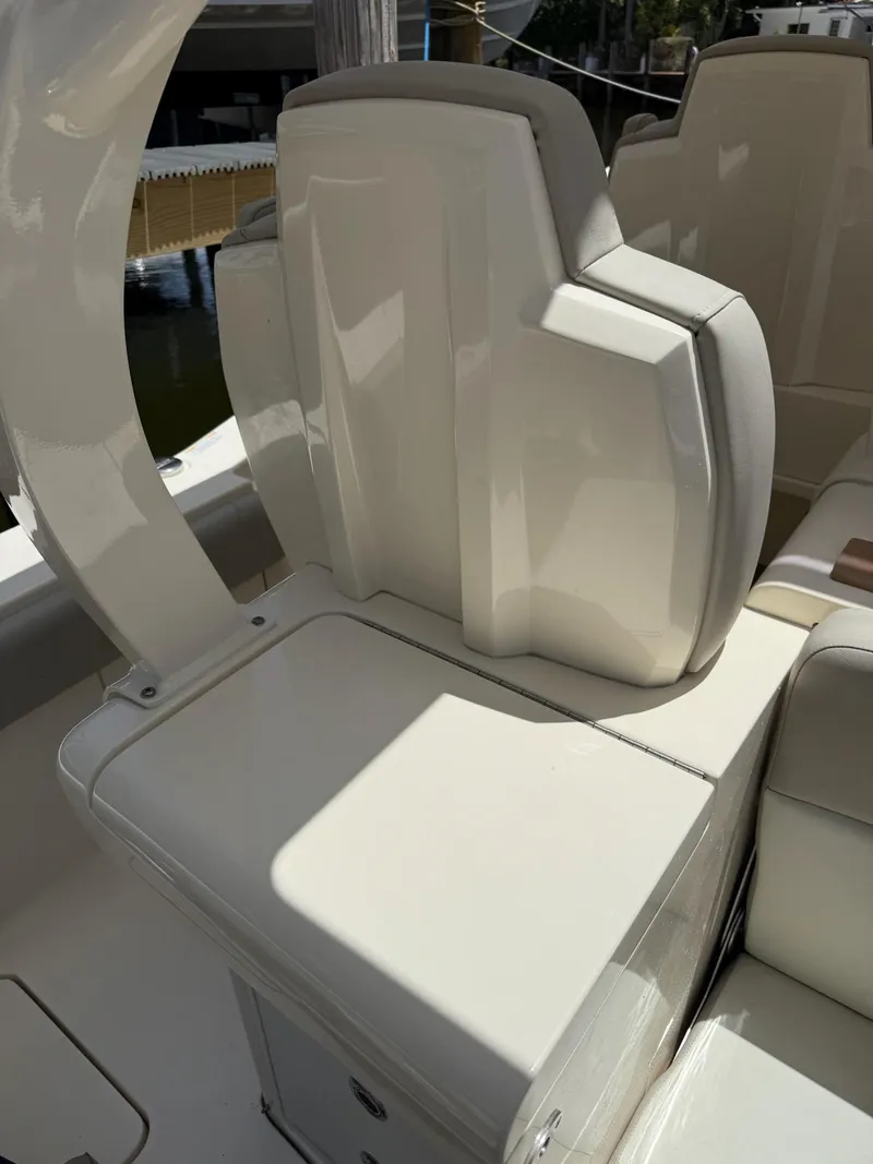 Slide: The Image of Open storage compartment on a 2019 Scout 420 LXF boat. - 49