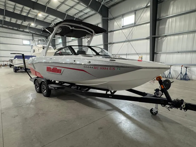 The Image of 2022 Malibu Wakesetter 23 LSV boat on trailer in indoor storage facility. - 0