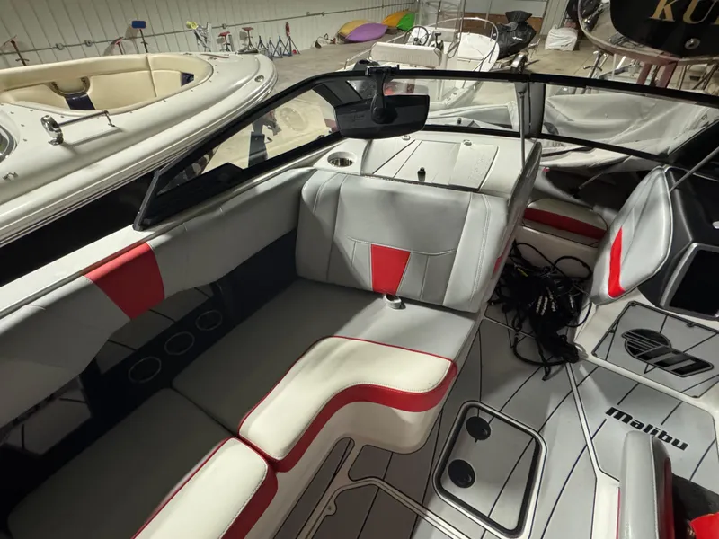 Slide: The Image of Interior of a 2022 Malibu Wakesetter 23 LSV boat with red and white seating. - 10