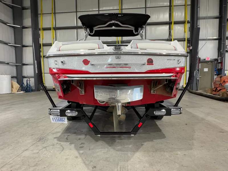 Slide: The Image of 2022 Malibu Wakesetter 23 LSV boat in a warehouse, rear view. - 5