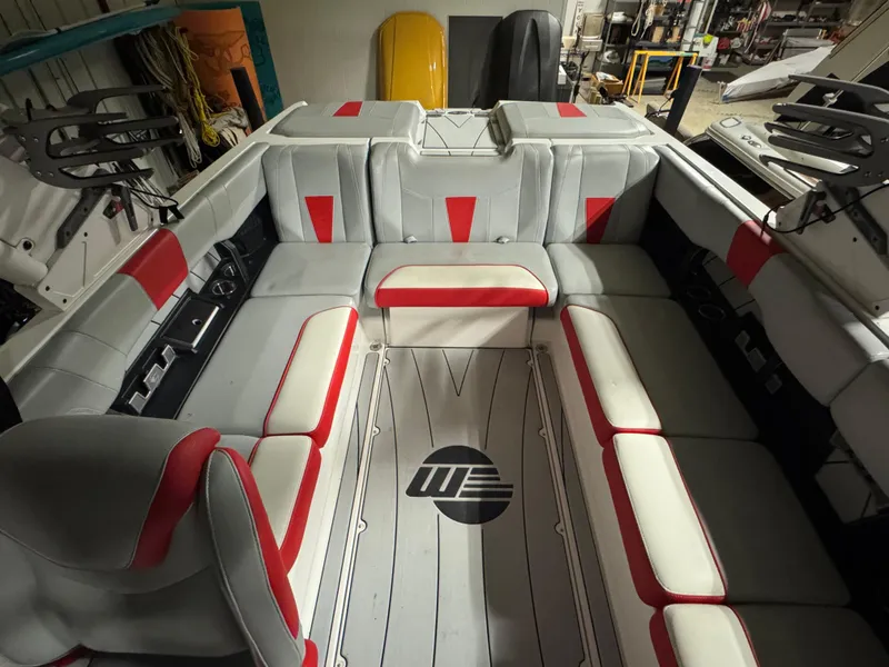 Slide: The Image of Interior of 2022 Malibu Wakesetter 23 LSV boat with red and gray seating. - 6