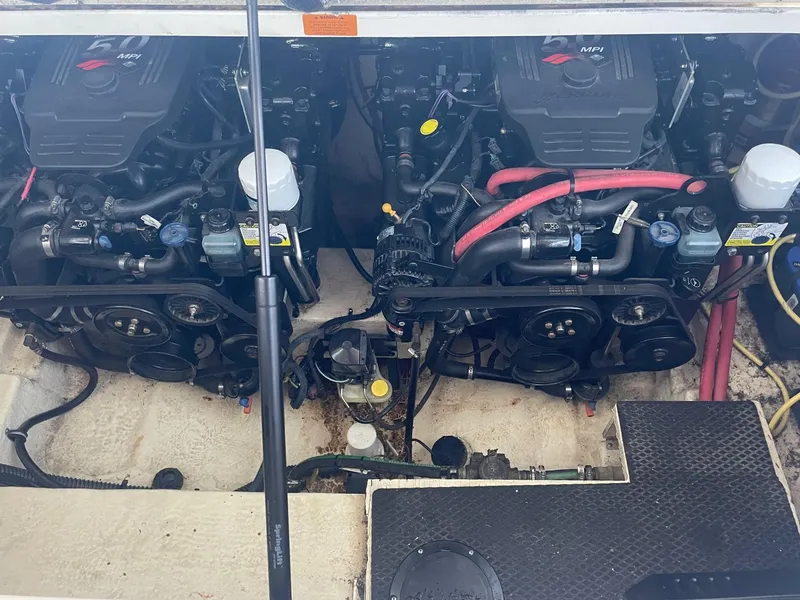 Slide: The Image of Engine compartment of a 2004 Chaparral Signature 290 boat, featuring dual 5.0 MPI engines. - 22
