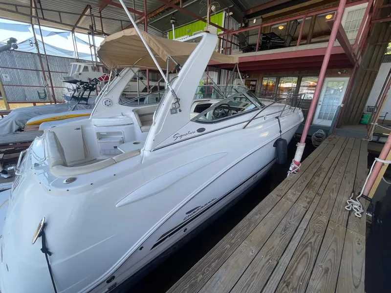 Slide: The Image of 2004 Chaparral Signature 290 boat docked in a covered marina. - 6