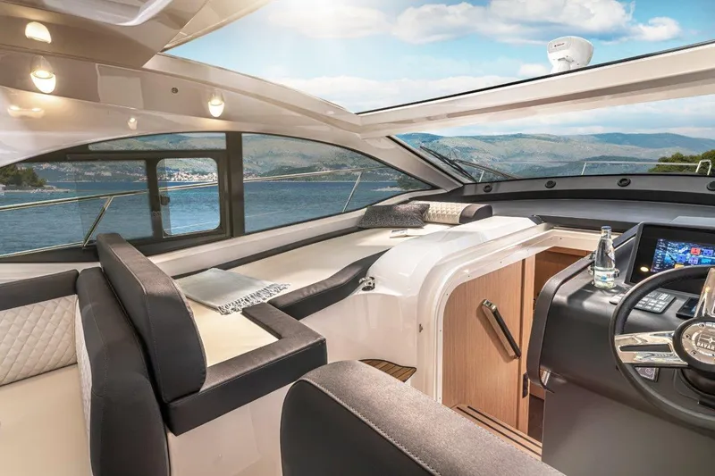 Slide: The Image of Luxurious interior of 2023 Bavaria SR41 COUPE yacht with scenic ocean view. - 13