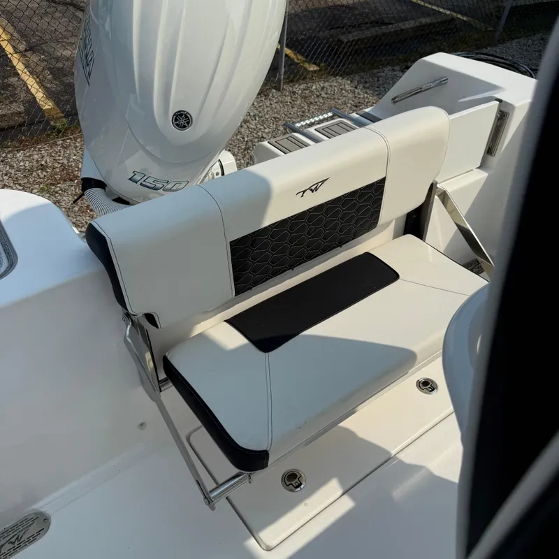 Slide: The Image of 2026 Tidewater 210CC boat with Yamaha 150 engine, featuring sleek seating design. - 17