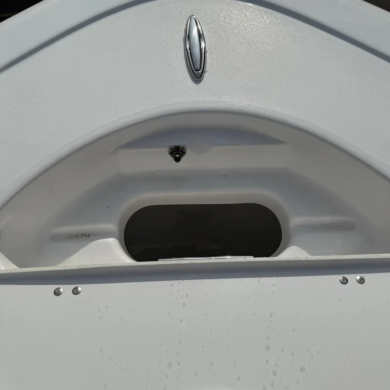 Slide: The Image of 2026 Tidewater 210CC boat detail, featuring sleek white design and chrome accents. - 19