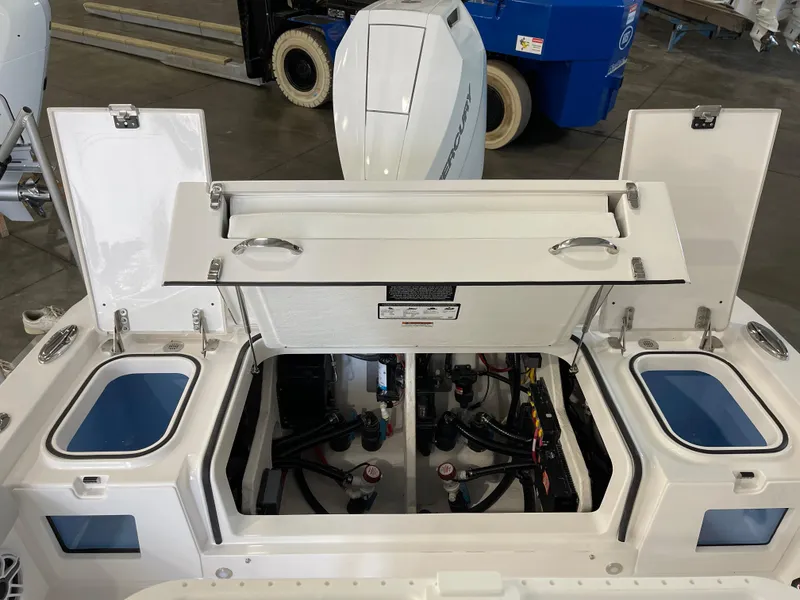 Slide: The Image of 2026 Blackfin 262 HB boat interior with open compartments and visible engine components. - 11