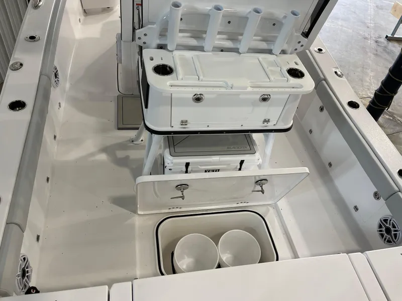 Slide: The Image of 2026 Blackfin 262 HB boat interior with storage compartments and rod holders. - 12