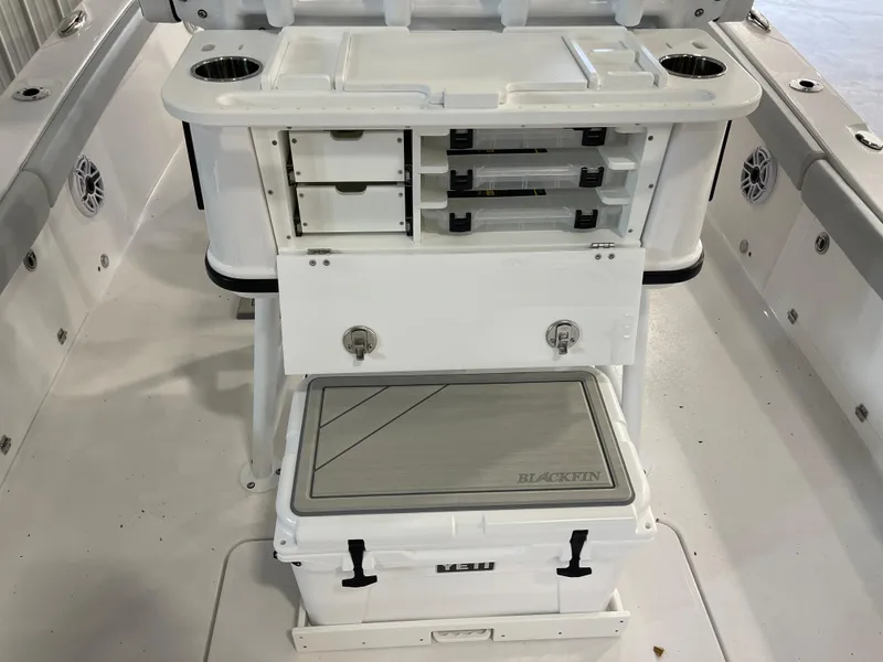 Slide: The Image of 2026 Blackfin 262 HB boat interior with storage compartments and cooler. - 13