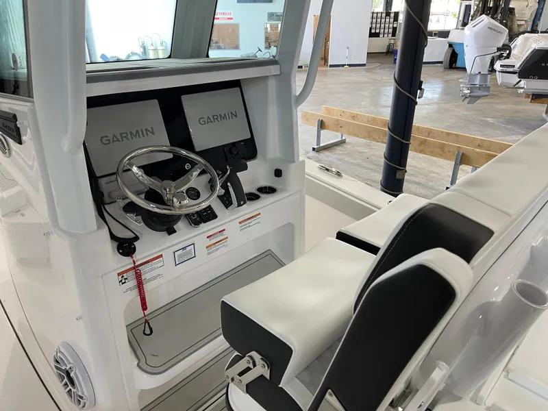 Slide: The Image of 2026 Blackfin 262 HB boat cockpit with dual Garmin displays and steering wheel. - 17