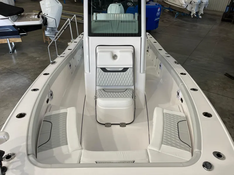Slide: The Image of 2026 Blackfin 262 HB boat interior with cushioned seating and modern design. - 23