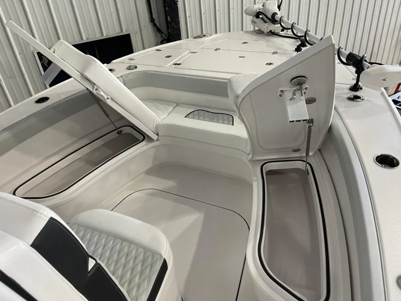 Slide: The Image of 2026 Blackfin 262 HB boat interior with open storage compartments and seating. - 24