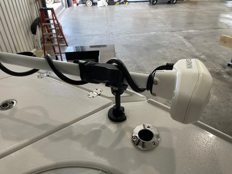 Slide: The Image of 2026 Blackfin 262 HB boat with Garmin equipment in a garage setting. - 29
