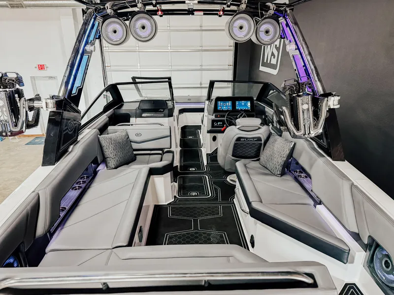Slide: The Image of 2025 Cobalt R8 Surf boat interior with modern seating and advanced dashboard technology. - 13