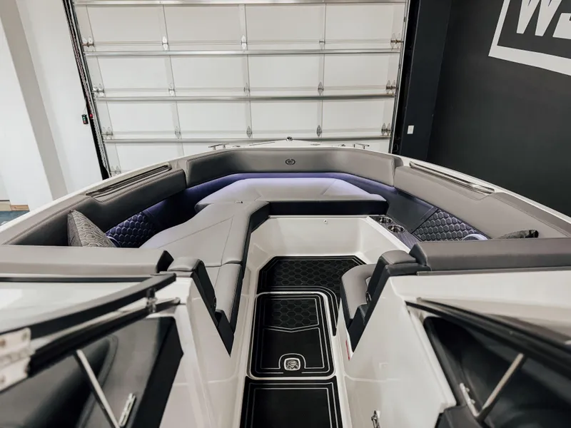 Slide: The Image of 2025 Cobalt R8 Surf boat interior with modern seating and sleek design. - 4