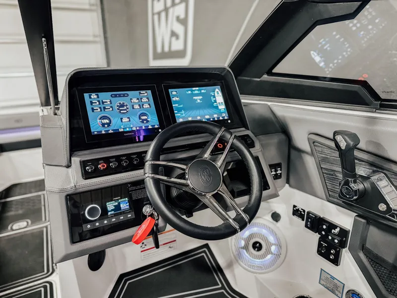 Slide: The Image of 2025 Cobalt R8 Surf boat dashboard with advanced digital displays and controls. - 8