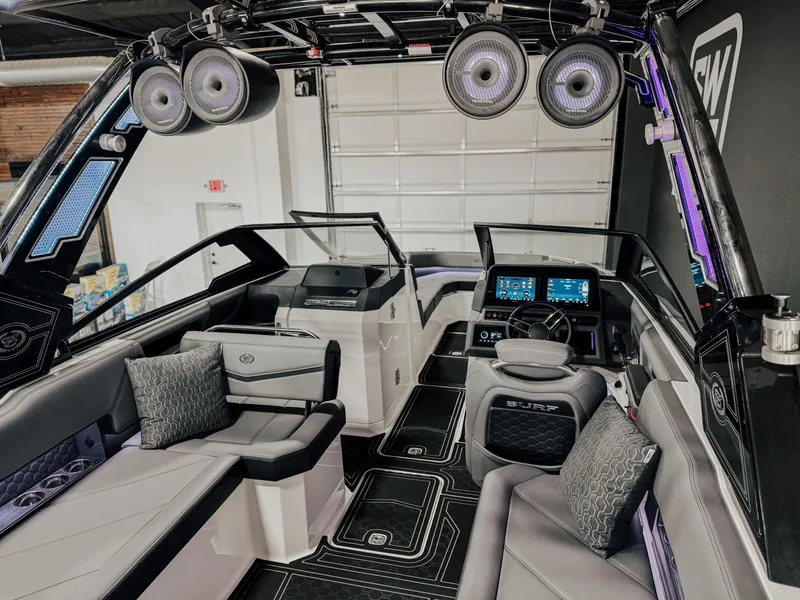 Slide: The Image of Interior of 2025 Cobalt R8 Surf boat with modern seating and advanced dashboard. - 9