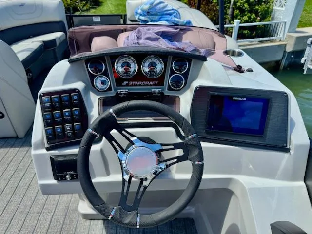 Slide: The Image of 2022 Starcraft CX 25 Q DH pontoon boat on trailer at Nautical Ventures. - 12