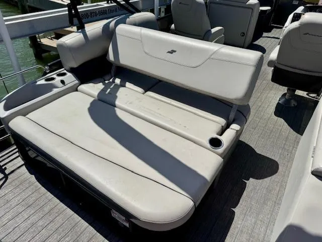 Slide: The Image of 2022 Starcraft CX 25 Q DH boat dashboard with steering wheel and control panel. - 18