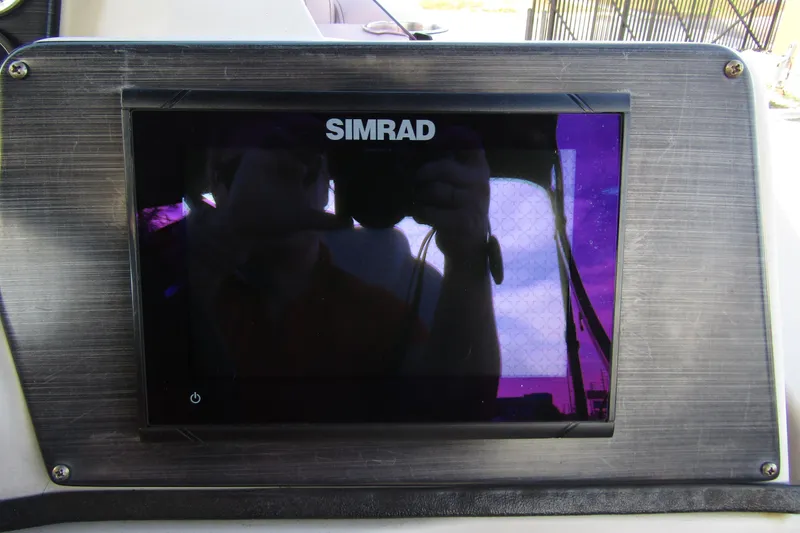 Slide: The Image of Simrad display on 2022 Starcraft CX 25 Q DH boat dashboard. - 24