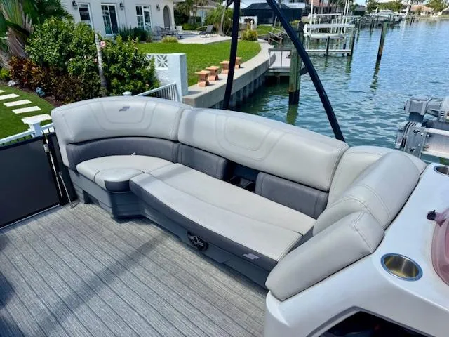 Slide: The Image of 2022 Starcraft CX 25 Q DH pontoon boat on trailer at Nautical Ventures dealership. - 8