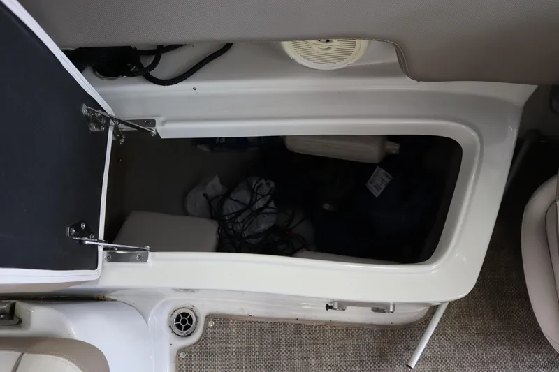 Slide: The Image of Open storage compartment in 2019 Crownline Eclipse E215 XS boat interior. - 12