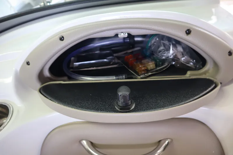 Slide: The Image of Open storage compartment in 2019 Crownline Eclipse E215 XS boat. - 14