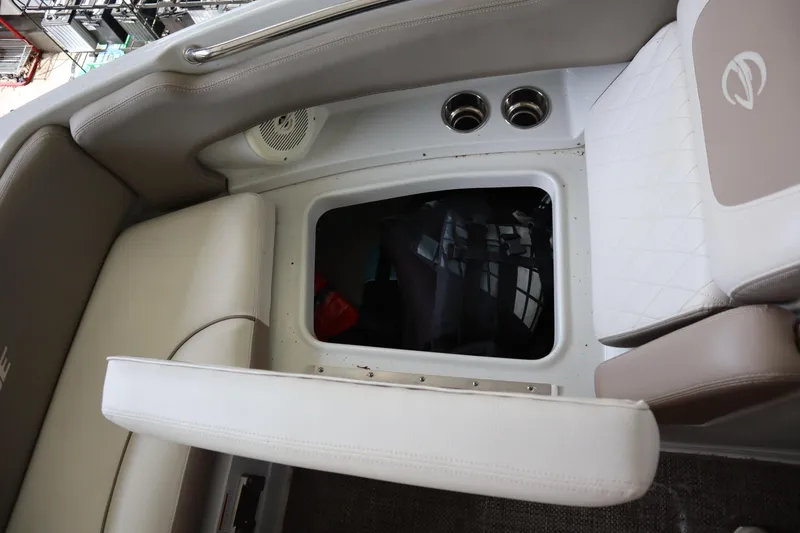 Slide: The Image of 2019 Crownline Eclipse E215 XS boat interior storage compartment with cushioned seating. - 6