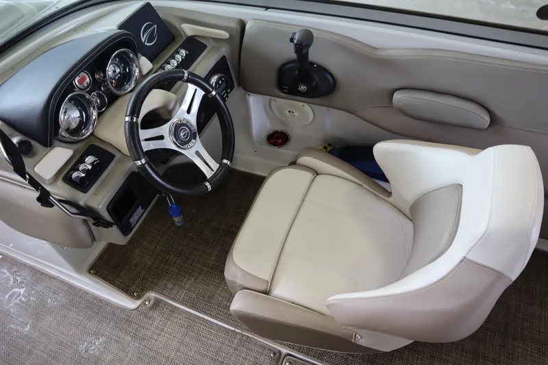 Slide: The Image of 2019 Crownline Eclipse E215 XS boat interior with steering wheel and captain's chair. - 9