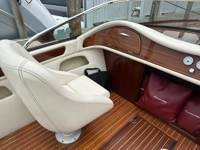 Slide: The Image of Interior of a 2015 Comitti Venezia 22 boat with elegant wood and leather details. - 11