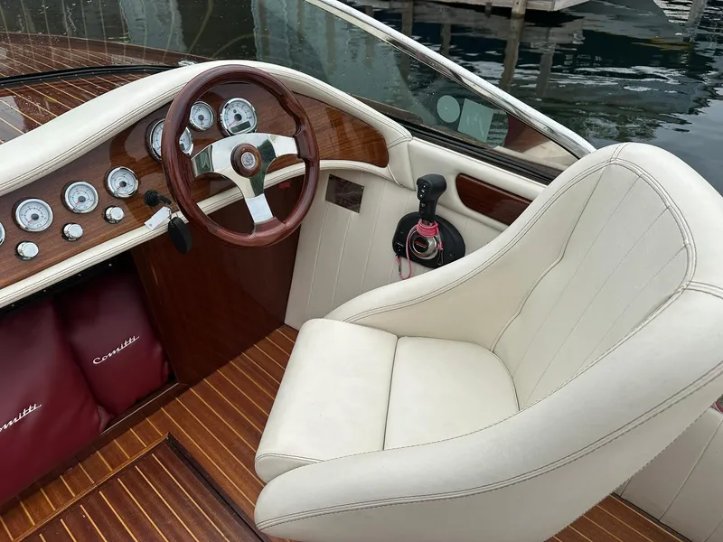 Slide: The Image of Luxurious 2015 Comitti Venezia 22 boat interior with wooden dashboard and white leather seat. - 12