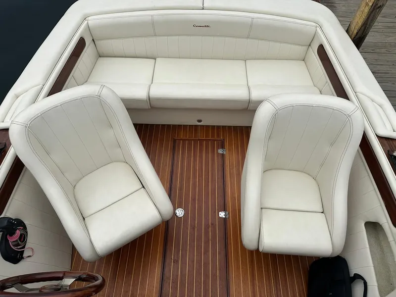Slide: The Image of Luxury interior of 2015 Comitti Venezia 22 boat with white leather seats and wooden flooring. - 16