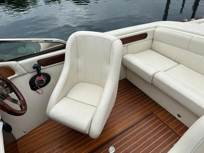 Slide: The Image of Luxurious interior of 2015 Comitti Venezia 22 boat with white leather seating and wooden flooring. - 18