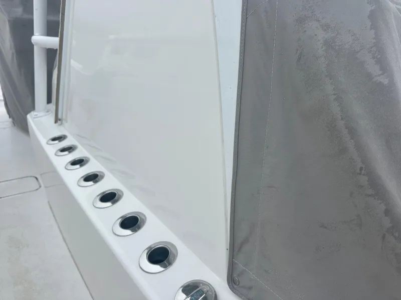 Slide: The Image of 2020 Invincible 39 Open Fisherman boat with rod holders and protective cover. - 12